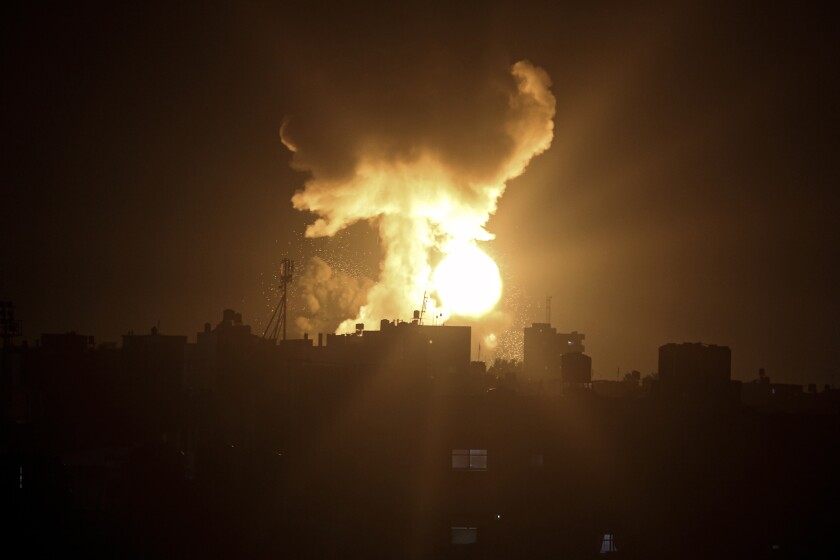 An explosion caused by Israeli airstrikes is seen in the town of Khan Younis, southern Gaza Strip, Sunday Jan, 2, 2022. Israel’s military says it launched strikes against militant targets in the Gaza Strip, a day after rockets were fired from the Hamas-ruled territory. (AP Photo/Yousef Masoud)