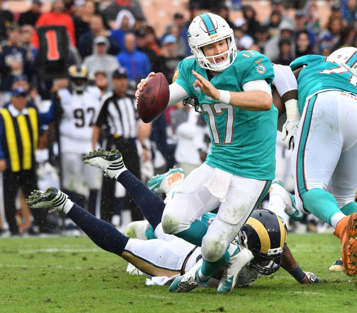 The Rams' Robert Quinn gets a sack at the expense of Dolphins quarterback Ryan Tannehill during Sunday's game.