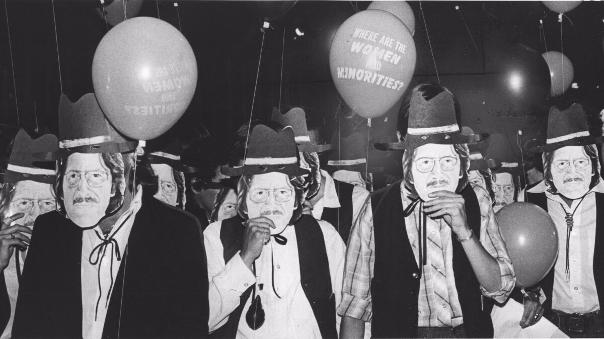 Demonstrators wearing masks of curator Maurice Tuchman protest the lack of representation of women and minorities at the Los Angeles County Museum of Art in 1981.