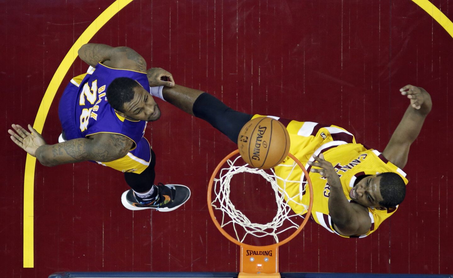 Cavaliers forward Tristan Thompson dunks the ball against Lakers forward Tarik Black during the first half of a game on Feb. 10.