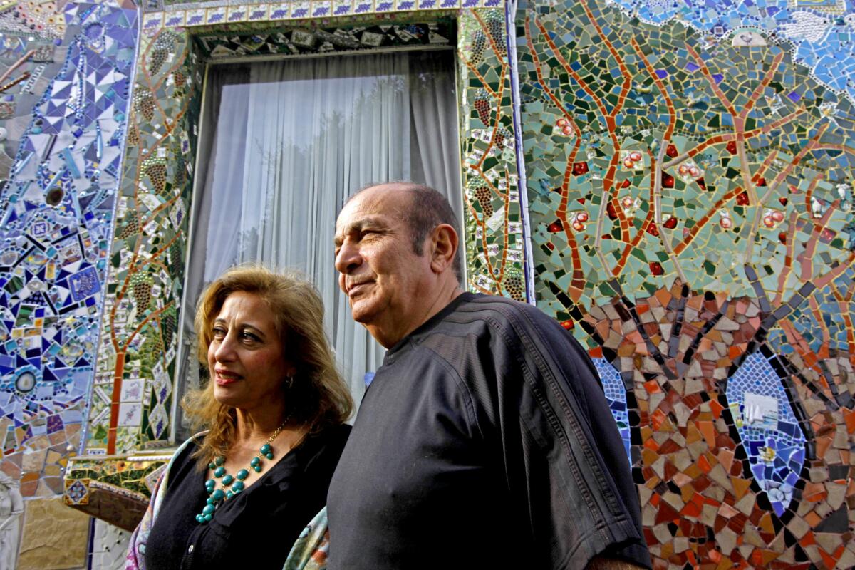 Louise and Aziz Farnam have spent the past 13 years applying various tiles, plates and glass to their 1930s bungalow in Santa Monica. They have finally finished the exterior of the home.