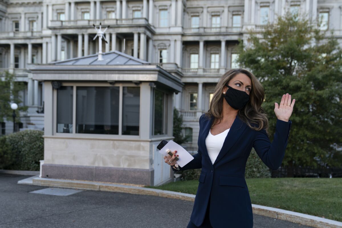 White House director of strategic communications Alyssa Farah waves after speaking at the White House on Oct. 8