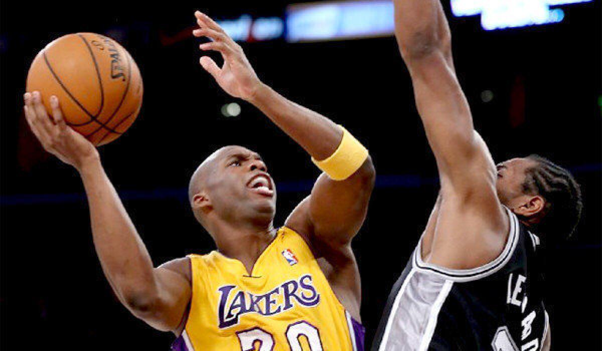Lakers guard Jodie Meeks, trying to score over Spurs forward Kawhi Leonard during a game earlier this month, came into the season with career accuracy of 40.4% overall, 36.7% from three-point range.