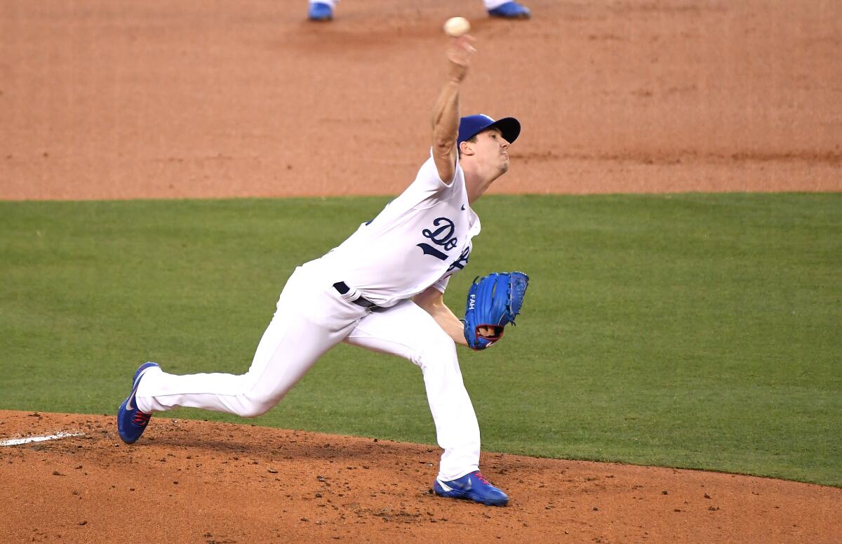 Dodgers pitcher Walker Buehler delivers.