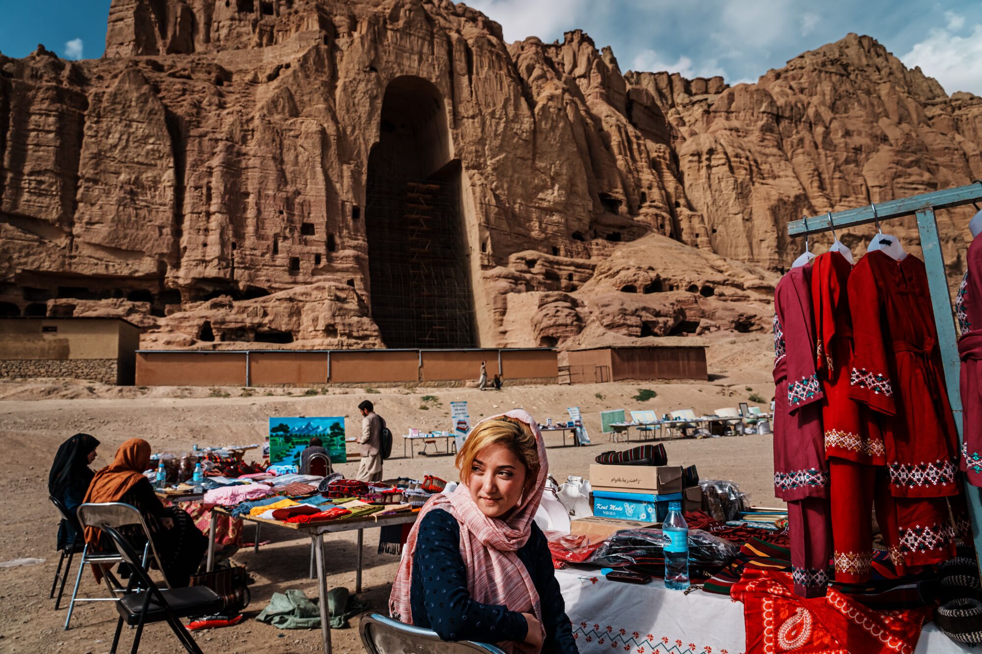 Narges Razuli, 16, works in a makeshift outdoor bazaar.