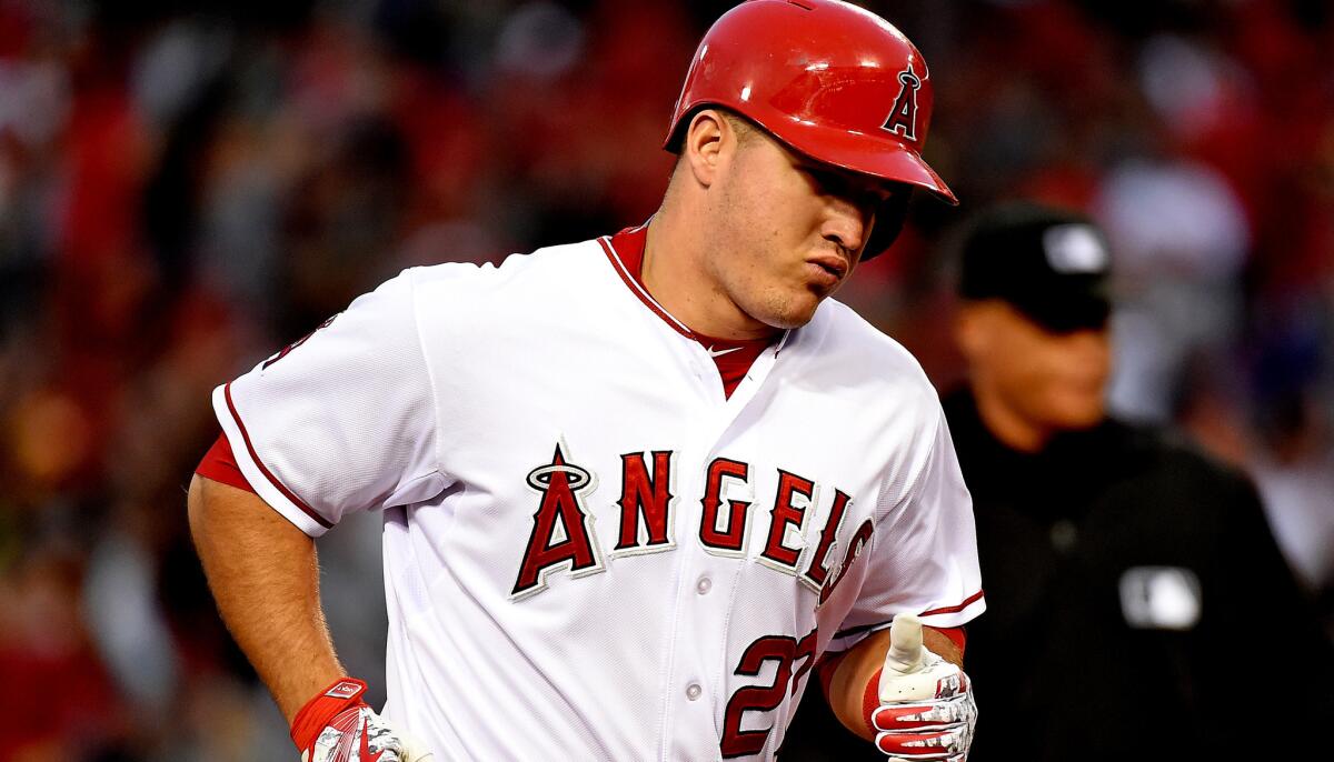 Angels center fielder Mike Trout rounds the bases after hitting a home run against the Astros in the fifth inning of a game May 9.