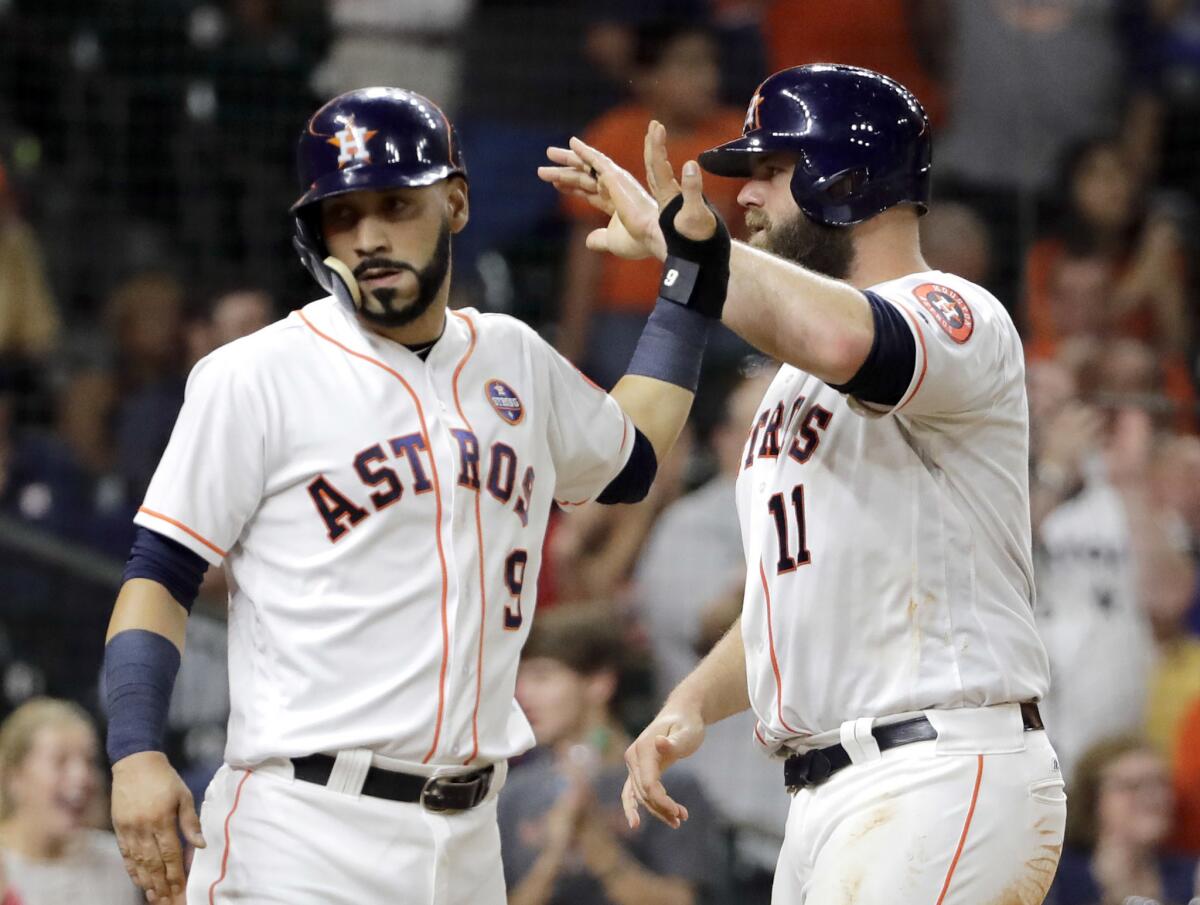 Marwin Gonzalez, left, and Evan Gattis