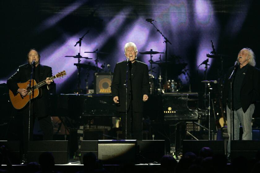 Stephen Stills, left, Graham Nash and David Crosby, shown performing in Los Angeles in 2010, will headline an Autism Speaks benefit on April 13 in Los Angeles.