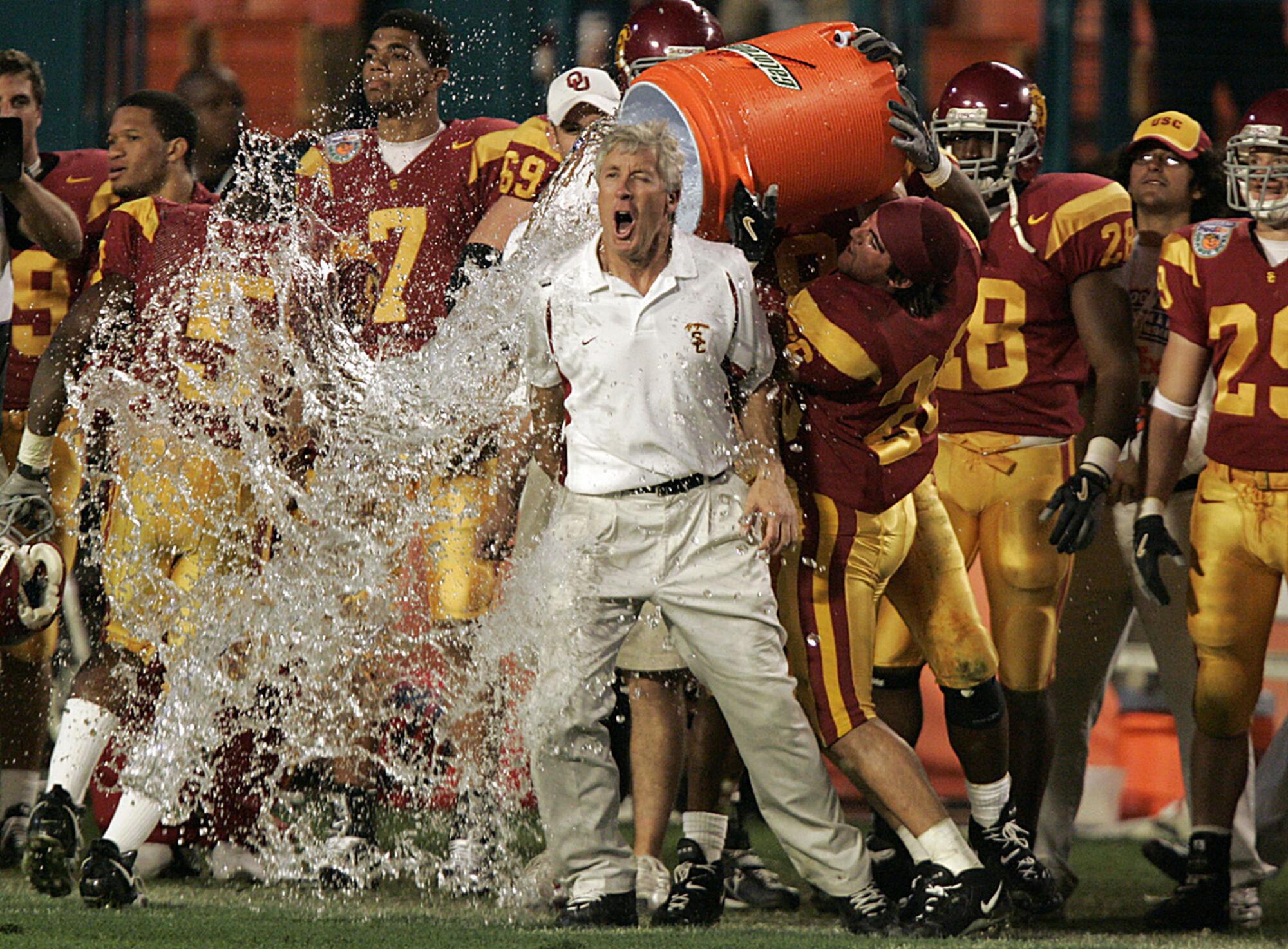 Pete Carroll gets doused in the waning moments of the Trojans' victory over Oklahoma in the 2005 Orange Bowl.
