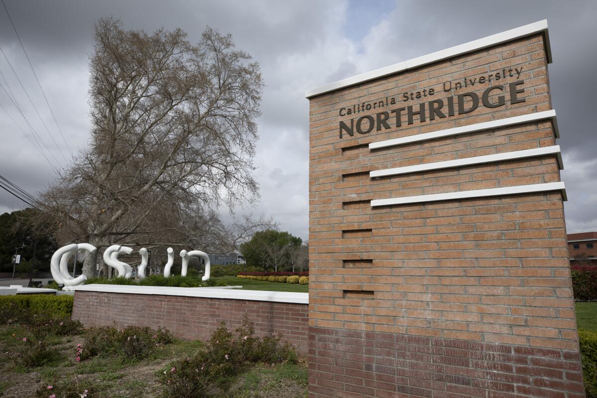 A brick sign marks the entrance to Cal State Northridge