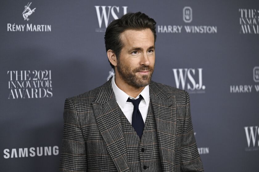 Ryan Reynolds poses for cameras at an event in New York City