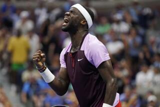 Frances Tiafoe, of the United States, celebrates after winning a point against Rafael Nadal.