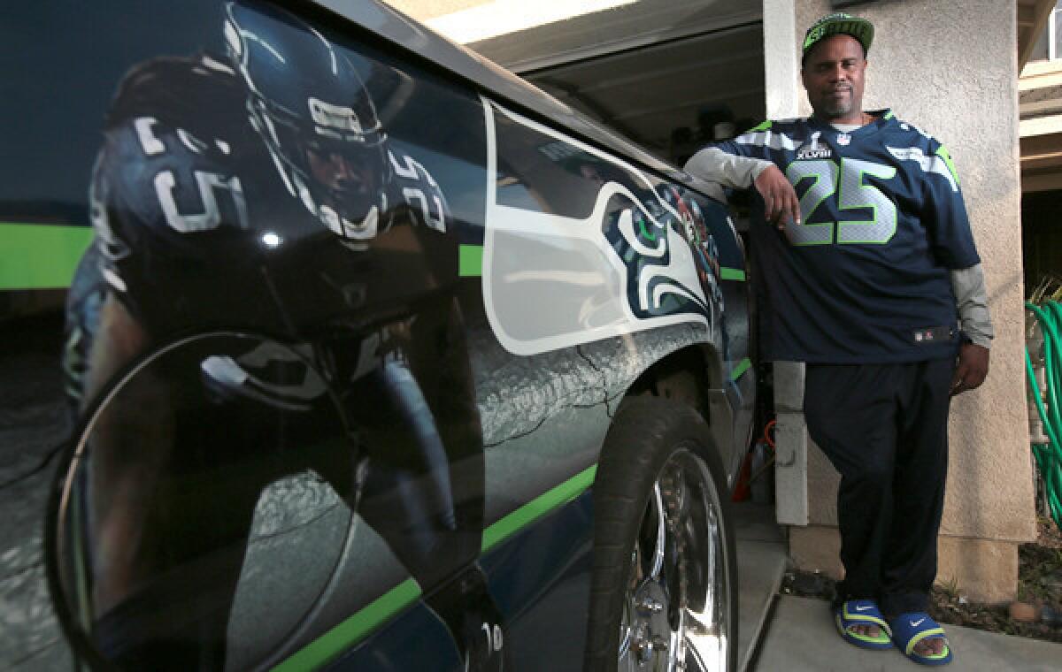 Kevin Sherman's truck is wrapped with images of his son, Seattle Seahawks star cornerback Richard Sherman. Kevin Sherman is proud of what his son has accomplished in life.
