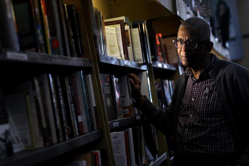 LOS ANGELES-CA-DECEMBER 18, 2019: James Fugate, co-owner of Eso Won Books in Leimert Park, is photographed on Wednesday, December 19, 2019. (Christina House / Los Angeles Times)