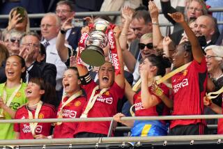 Manchester United's Katie Zelem lifted the trophy after winning the Women's FA Cup final soccer match between Manchester United and Tottenham Hotspur at Wembley Stadium in London, Sunday, May 12, 2024. Manchester United won 4-0. (AP Photo/Kirsty Wigglesworth)