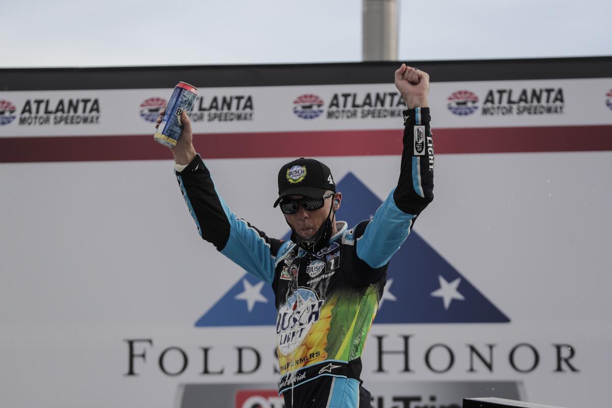 Kevin Harvick celebrates after winning a NASCAR Cup race at Atlanta Motor Speedway.