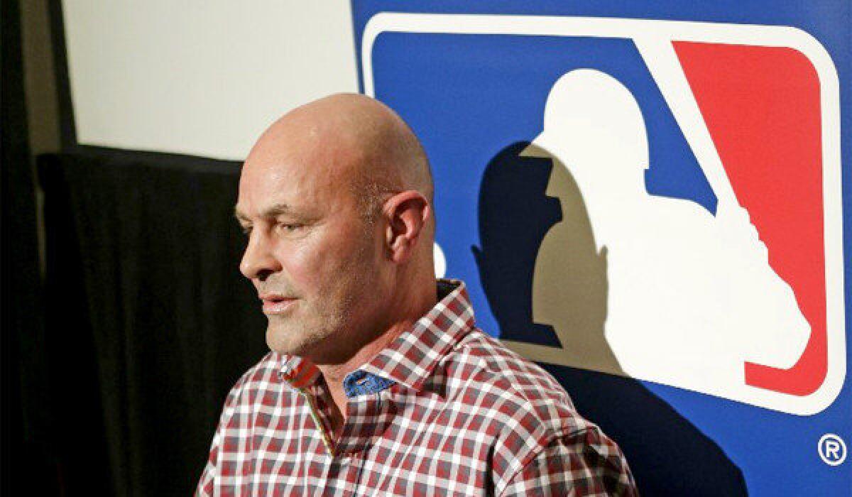 Kirk Gibson answers questions at a news conference at the MLB winter meetings in Lake Buena Vista, Fla. on Monday.