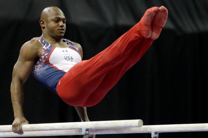 John Orozco competes on the parallel bars during the U.S. men's Olympic gymnastics trials in St. Louis on June 25.