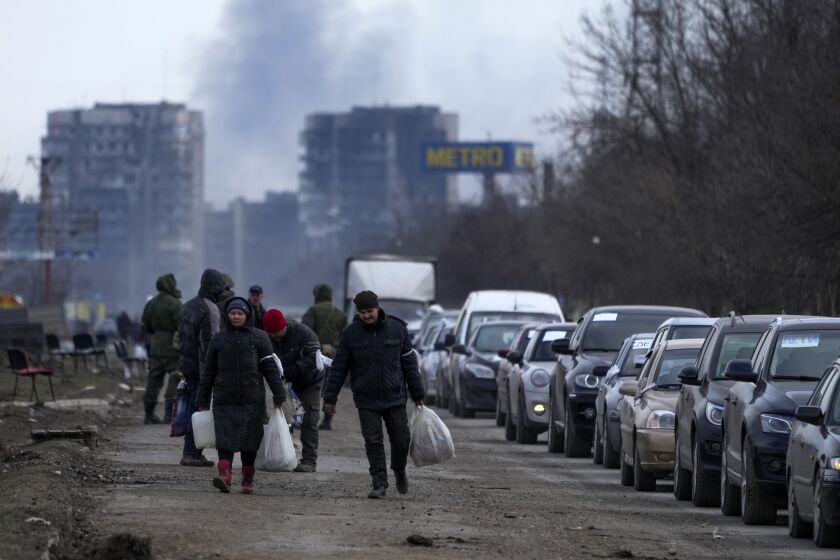 Civilians trapped in Mariupol, city under Russian attacks, are evacuated