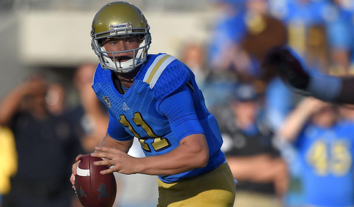 UCLA quarterback Jerry Neuheisel looks to pass against Stanford on Nov. 28.