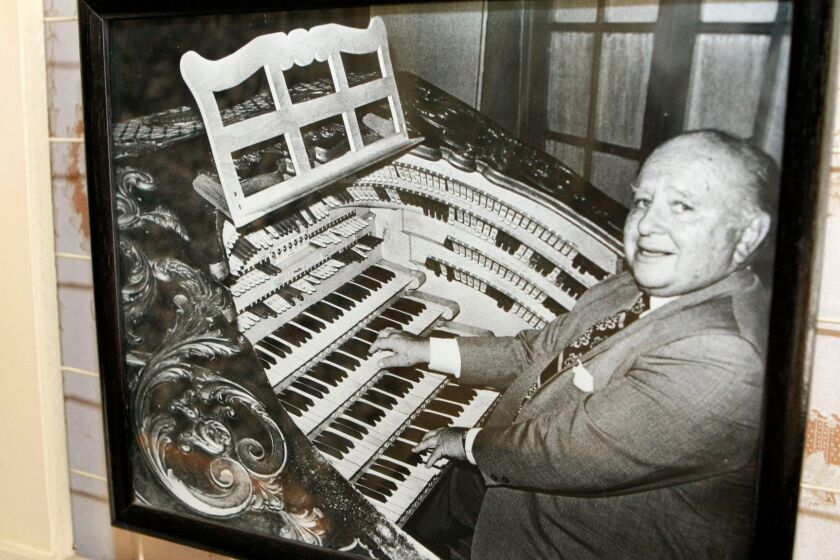 A photo of Frank Lanterman playing the organ is displayed at the new exhibit "The Legacy of Frank Lanterman 1901-1981" at the Lanterman House in La Cañada Flintridge.