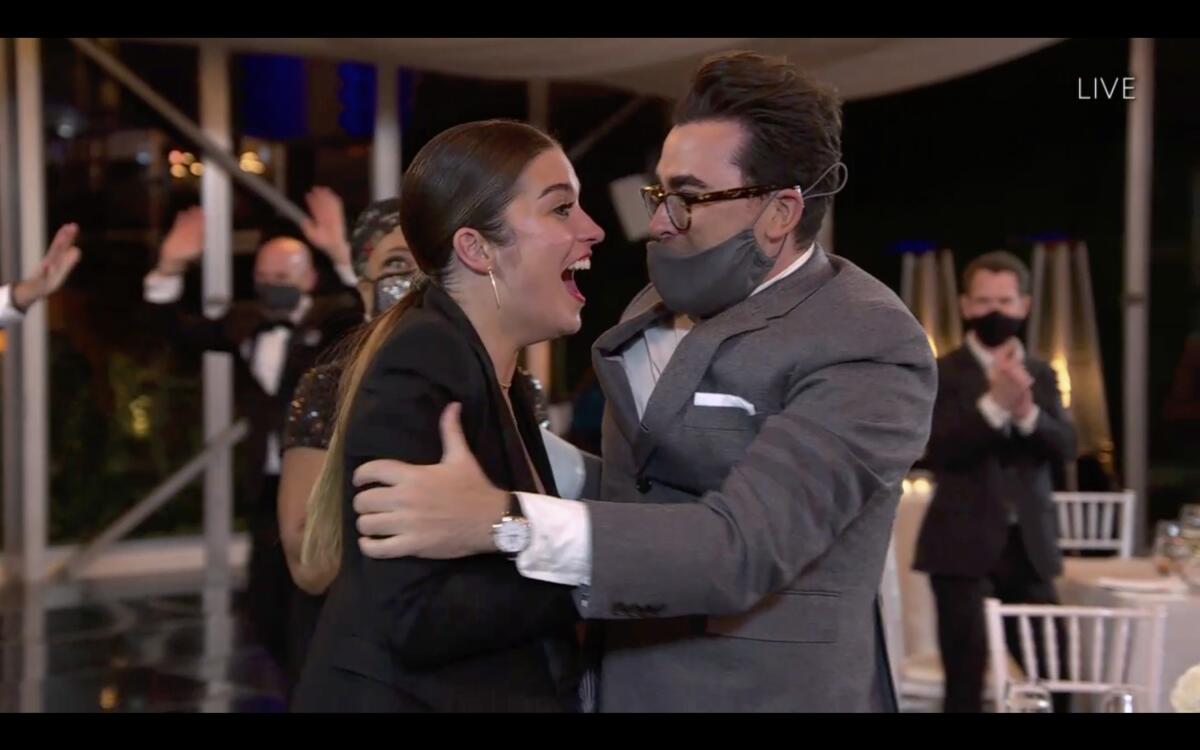Annie Murphy and Dan Levy celebrate Murphy's Emmy win on Sunday.