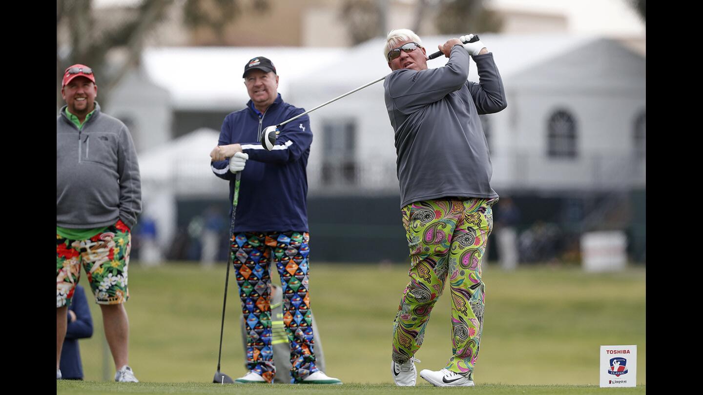 Professional golfer John Daly, right, tees off at Hole 7 during the 2018 Toshiba Classic Pro-Am at Newport Beach Country Club on Wednesday, March 7.