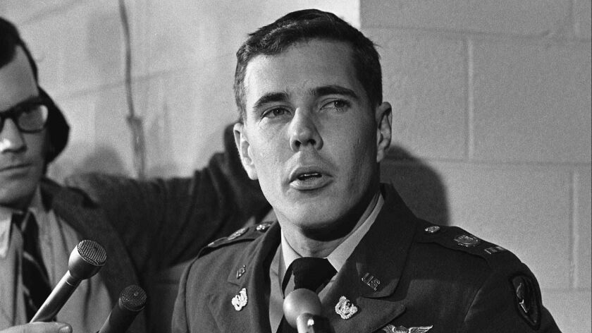 Helicopter pilot Hugh Thompson speaks with reporters at the Pentagon on Dec. 4, 1969, after testifying about the My Lai massacre in South Vietnam.