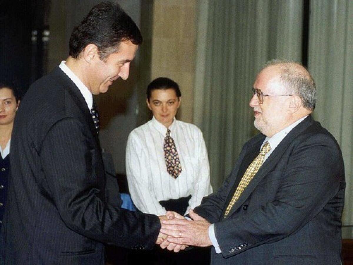Milo Djukanovic, left, president of Montenegro in 1999, greets Richard Sklar, who worked in southeastern Europe as a special U.S. envoy.