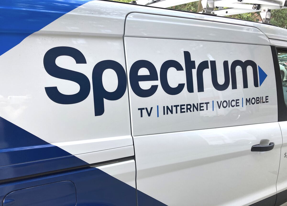A utility truck is branded for Spectrum internet.