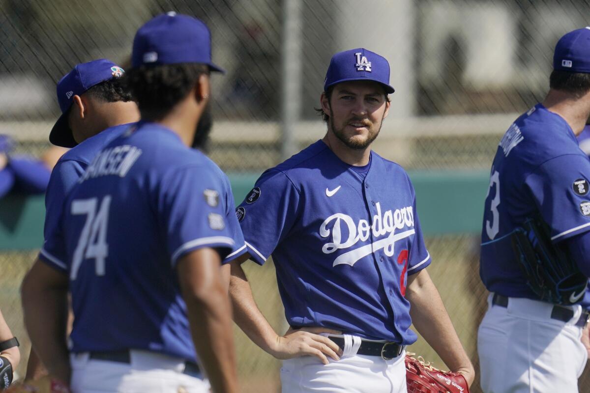 Dodgers starting pitcher Trevor Bauer, right, talks with relief pitcher Kenley Jansen.