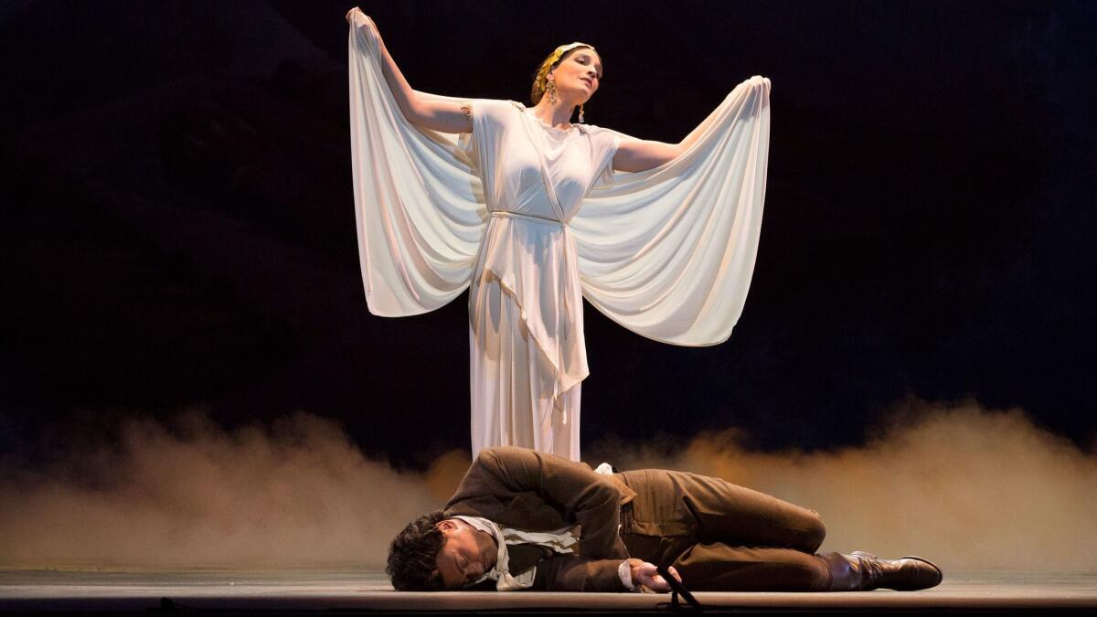 Kate Lindsey as "The Muse of Poetry" and Vittorio Grigolo as Hoffmann in the L.A. Opera production of "The Tales of Hoffmann."