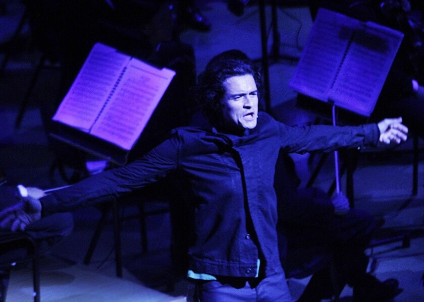 Orlando Bloom performs with the Simon Bolivar Symphony Orchestra.