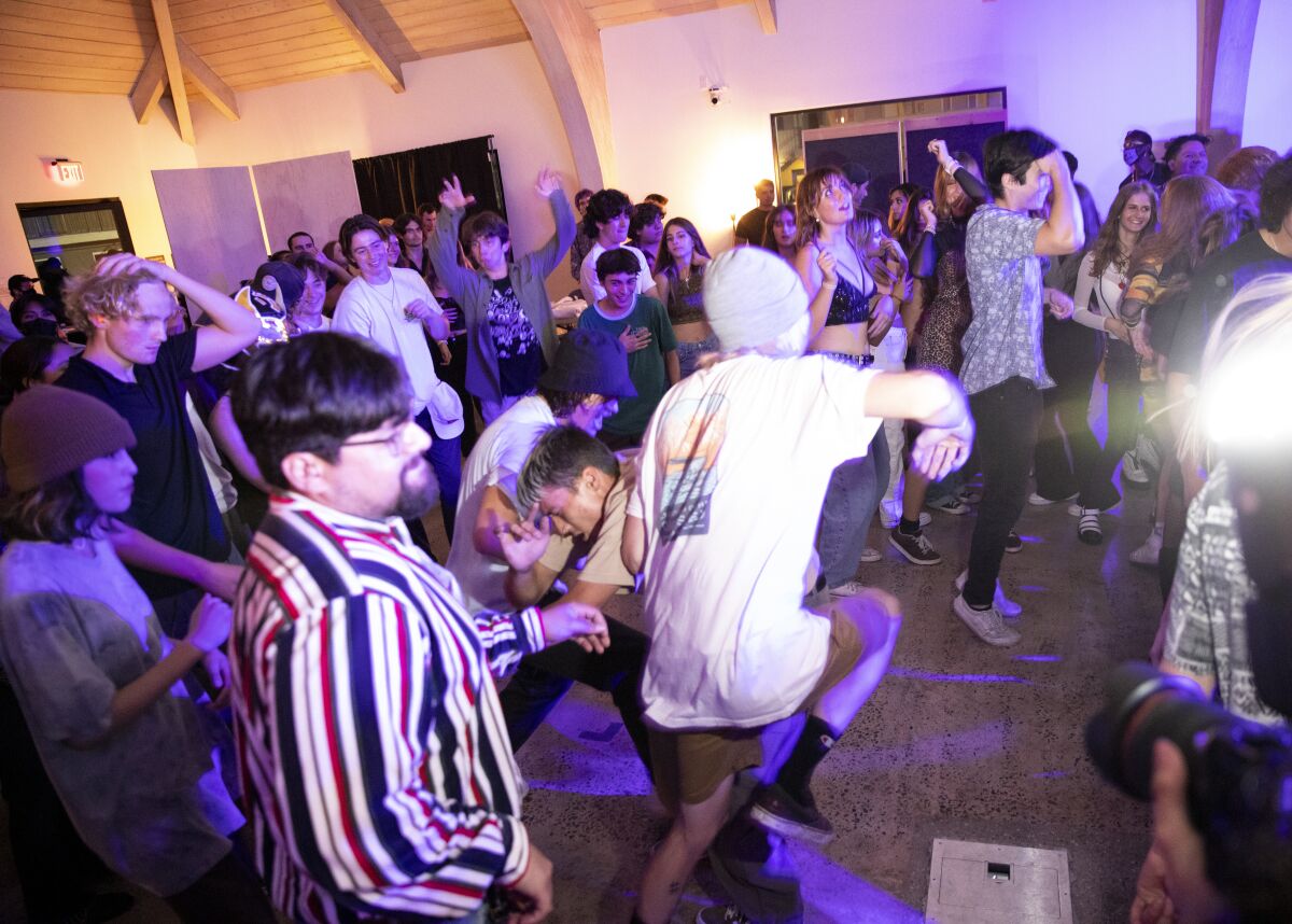 San Diego, California - November 05: Fans mosh during a show in a new music venue called Bridges