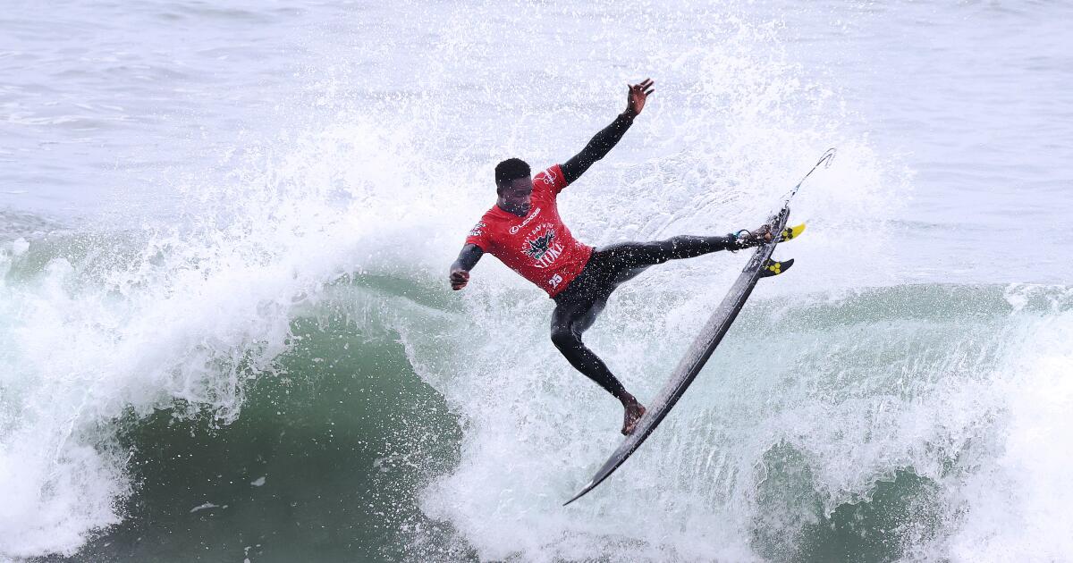 Photo: Black surfer riding on the waves Photo: Black surfer riding on the waves