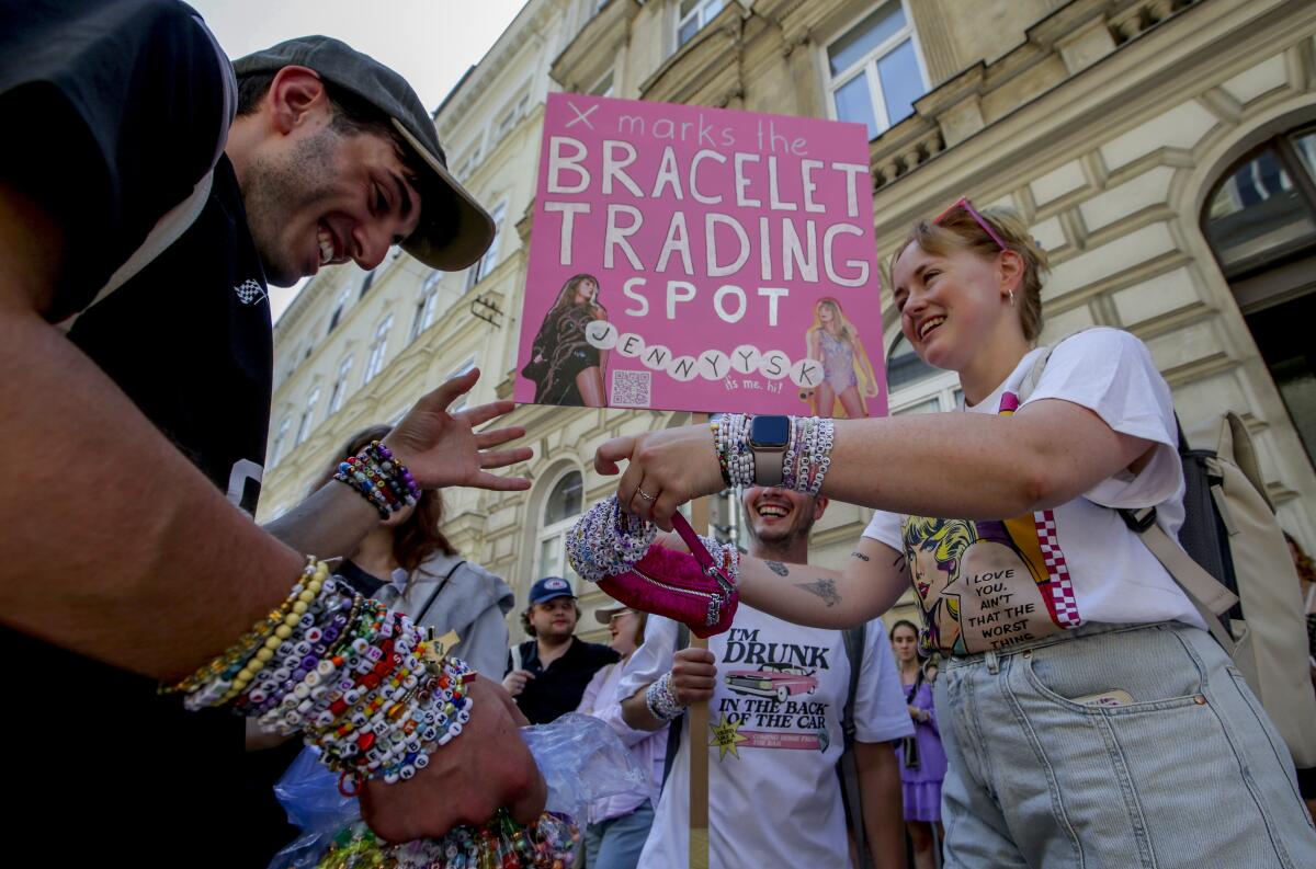 Swifties trade bracelets in the center of Vienna. 