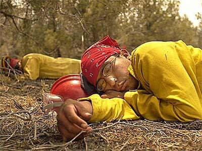 A hot shot fire crew member sleeps on the western edge of Show Low, Arizona.