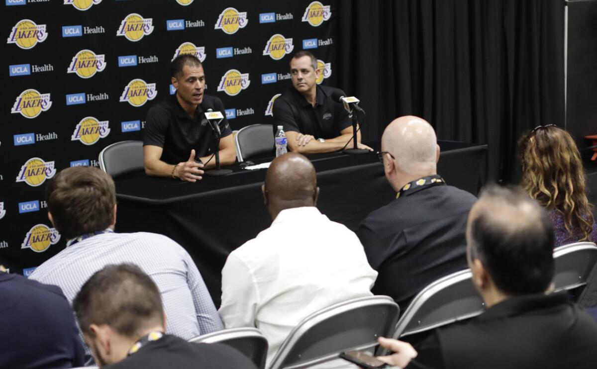 Rob Pelinka speaks alongside coach Frank Vogel during the Lakers' media day on Friday.