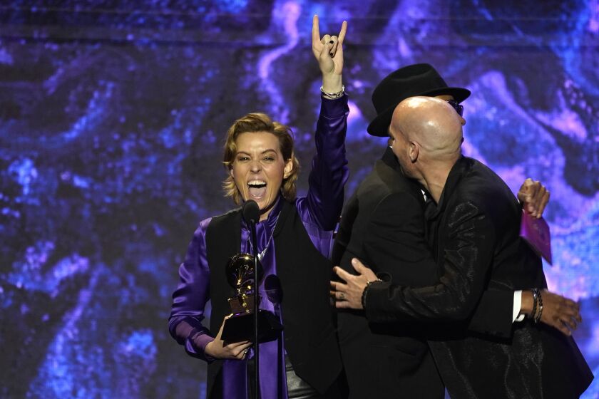 Brandi Carlile gestures onstage while accepting the award for best rock song for "Broken Horses" at the 65th annual Grammy Awards on Sunday, Feb. 5, 2023, in Los Angeles. (AP Photo/Chris Pizzello)