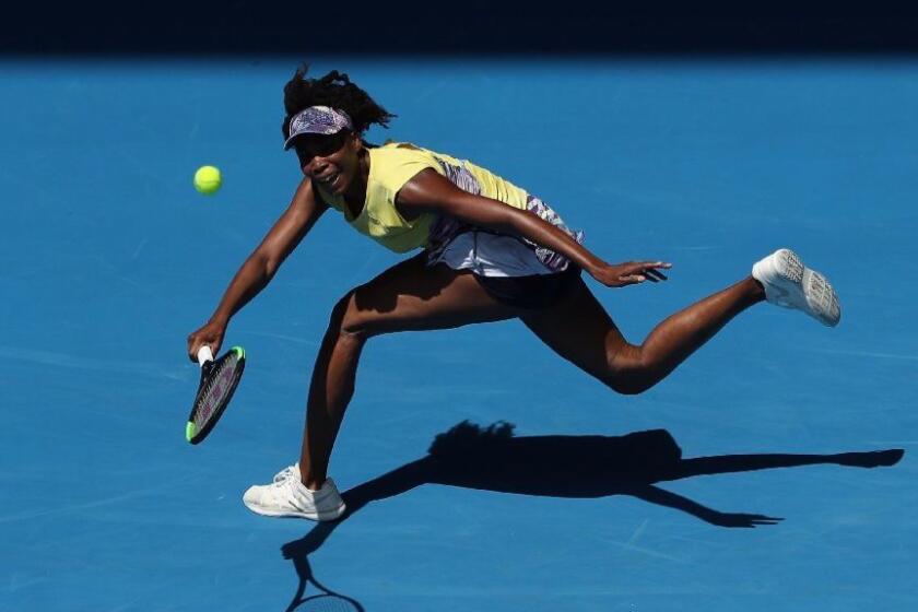 Venus Williams plays a forehand in her second-round match against Stefanie Voegele of Switzerland at the Australian Open on Jan. 18.