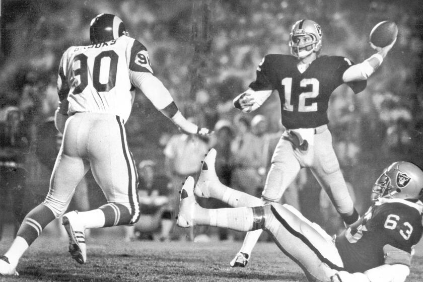 Oakland Raiders quarterback Ken Stabler gets off a pass against the Los Angeles Rams in a 1977 game. Stabler died in his native Alabama at the age of 69.