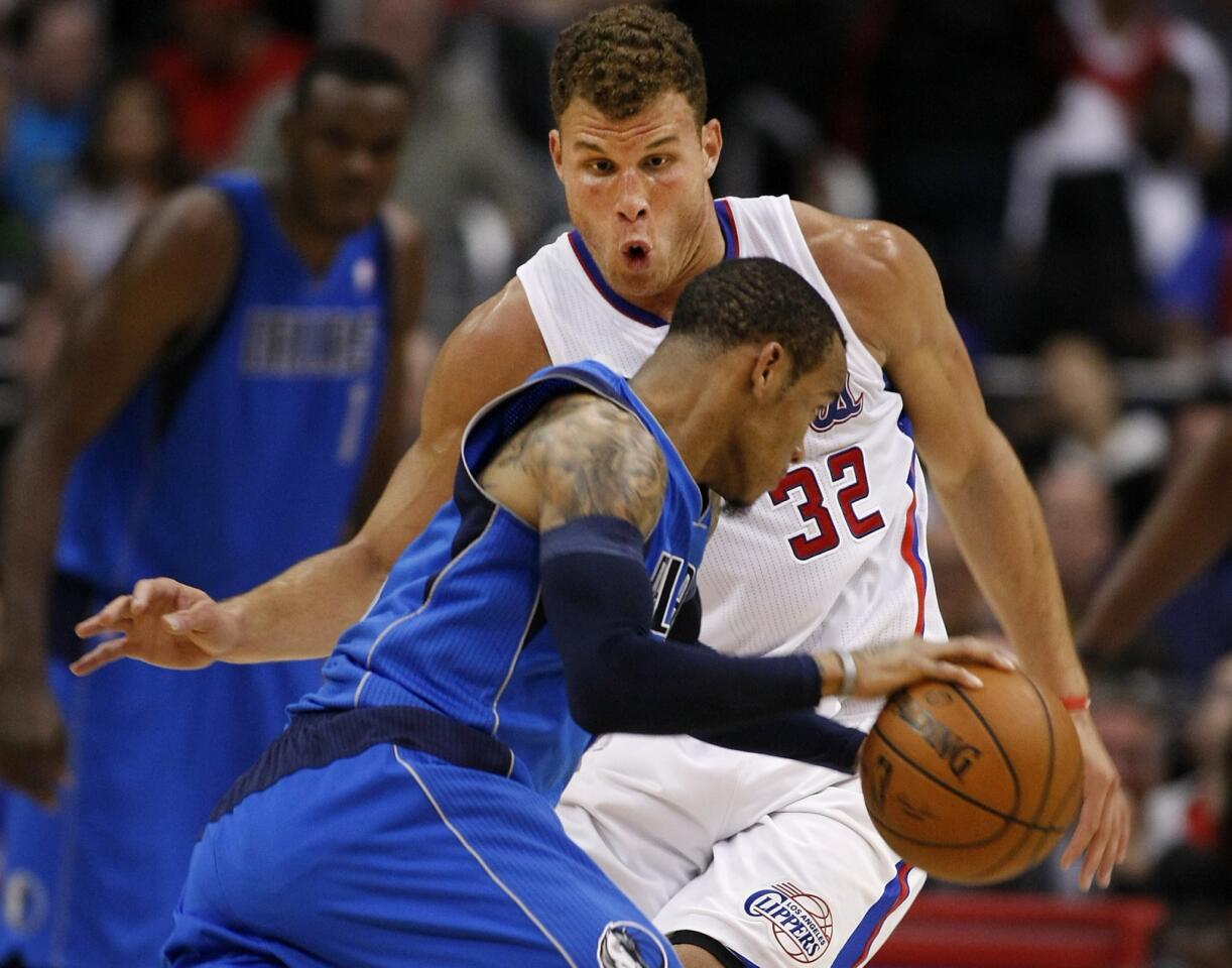 Dallas Mavericks guard Monta Ellis, front, drives on Clippers power forward Blake Griffin during the first half of Thursday's game at Staples Center.