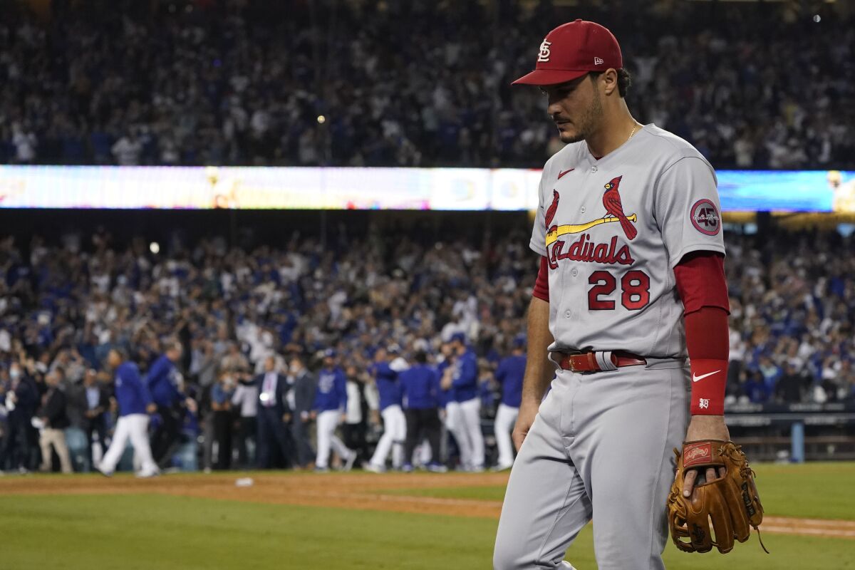 St. Louis Cardinals third baseman Nolan Arenado (28) leaves the field after the Los Angeles Dodgers won a National League Wild Card playoff baseball game 3-1 Wednesday, Oct. 6, 2021, in Los Angeles. (AP Photo/Marcio Jose Sanchez)