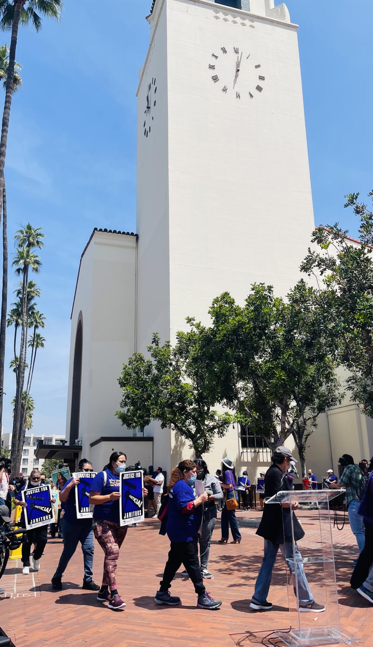 Protesters gather at Union Station on Thursday demanding more security for the janitors that work there. 