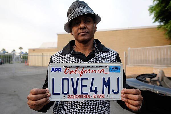 Jackson fan Demarco DeLeon shows his "Love4 MJ" license plate outside Forest Lawn.