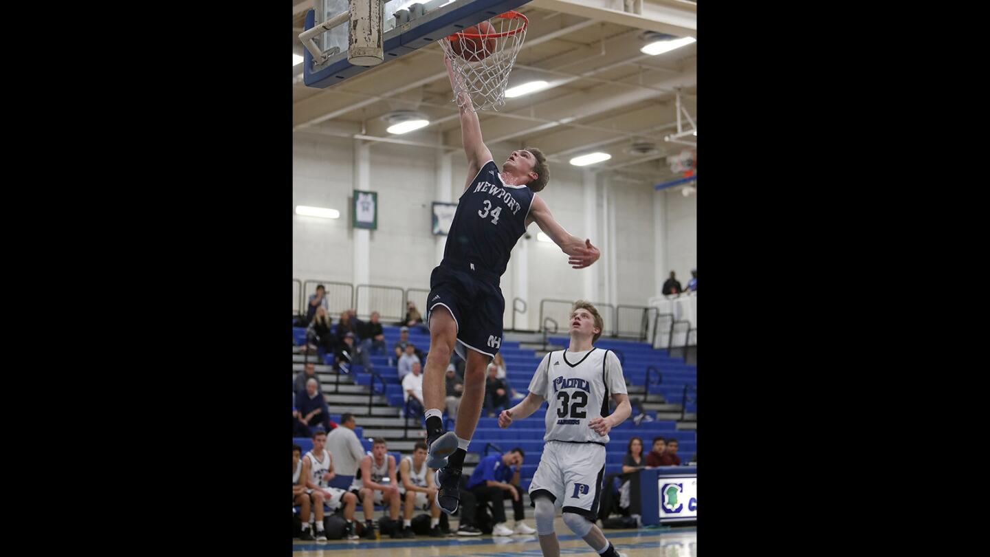 Newport Harbor High's Dayne Chalmers (34) dunks the ball during the first half against Pacifica in the Century Elks Holiday Classic on Saturday.