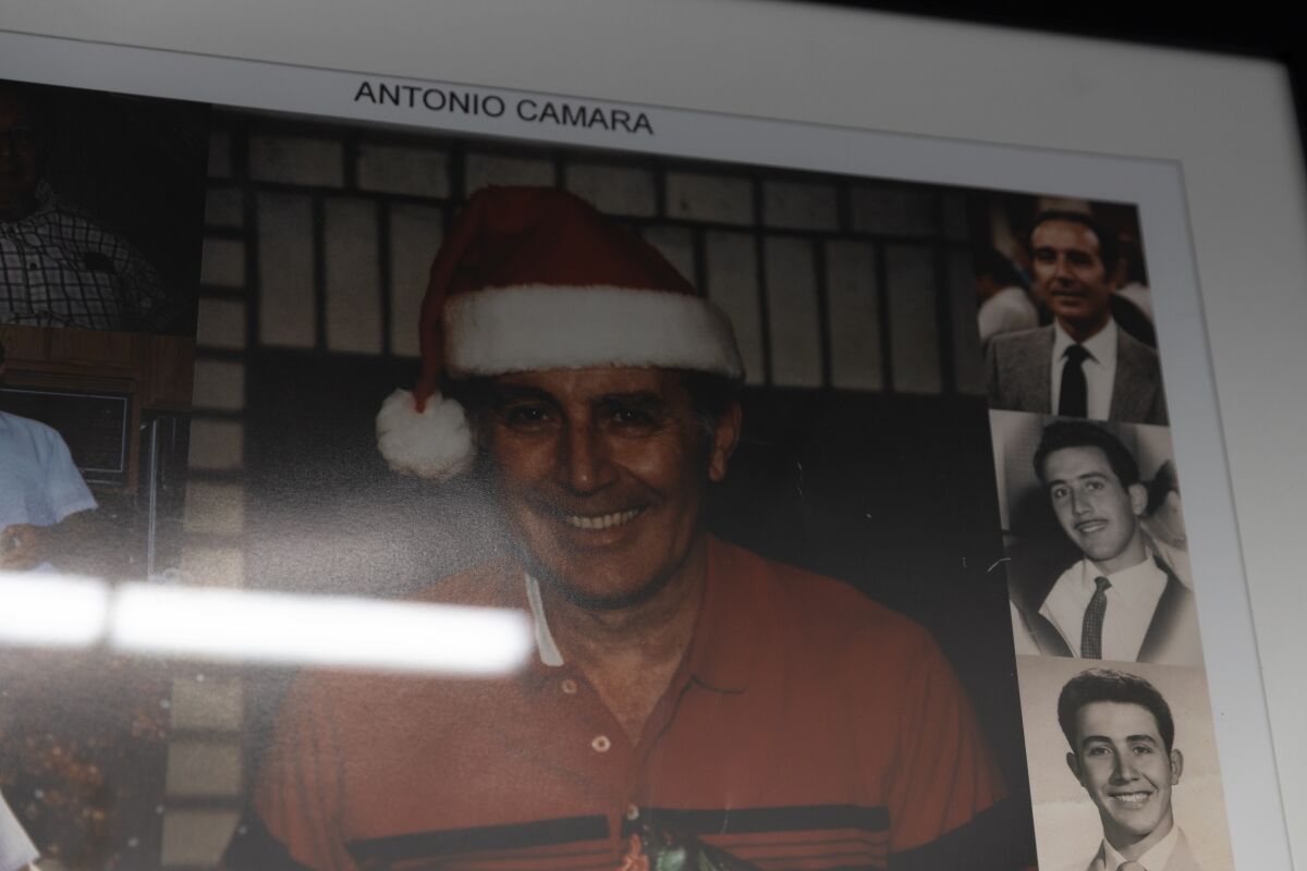 Pictures of late owner Antonio Camara are displayed at Highland Barber Shop in National City on Saturday, July 16, 2022.