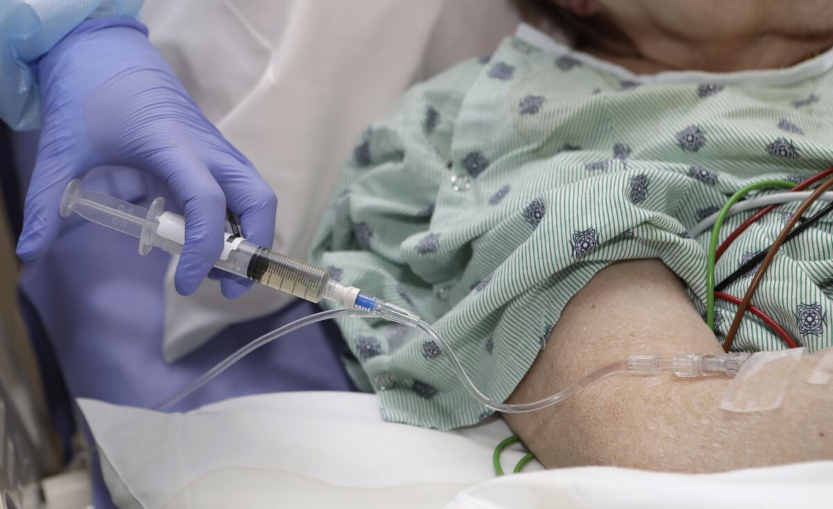 A hospital patient receives an IV