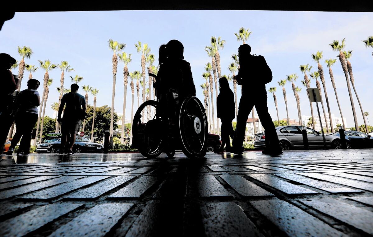 A woman in a wheelchair outside Union Station in downtown Los Angeles.