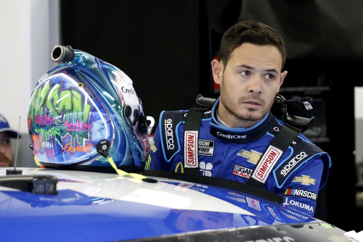NASCAR driver Kyle Larson gets ready to climb into his car to practice for the Daytona 500 on Feb. 14.